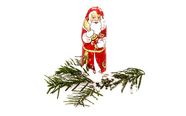 Image showing Chocolate Santa Claus in snow