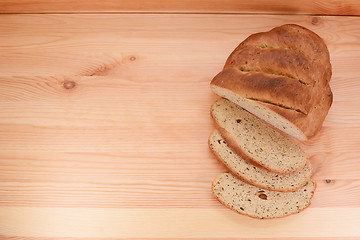 Image showing Fresh bread and cut slices 