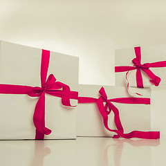 Image showing white gift box with nice ribbon