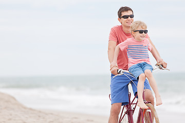 Image showing family biking at the beach