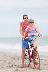 Image showing family biking at the beach