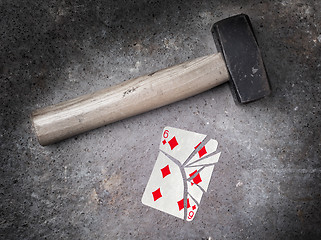 Image showing Hammer with a broken card, six of diamonds