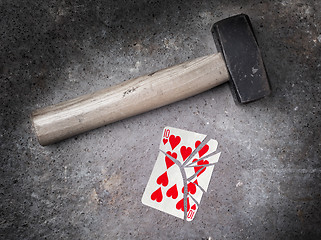 Image showing Hammer with a broken card, ten of hearts