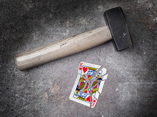 Image showing Hammer with a broken card, king of hearts