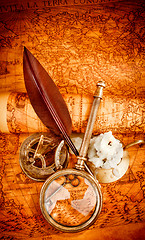 Image showing Vintage still life. Vintage items on ancient map.