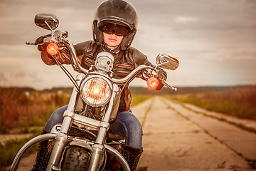 Image showing Biker girl on a motorcycle