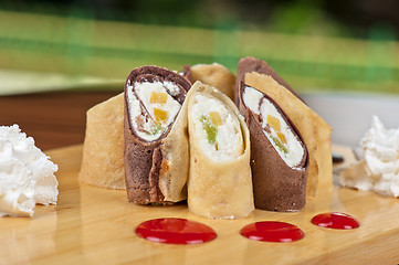 Image showing pancake roll with marmalade