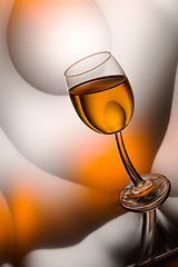 Image showing glass of cognac in a distorted reflection