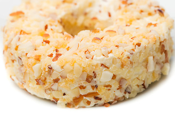 Image showing Round sweet dessert cheese with nuts and pineapple closeup