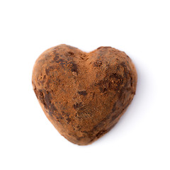 Image showing One truffle candy in a heart shape. Valentine's Day.