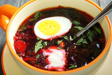 Image showing Beetroot soup with egg and sour cream.