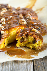 Image showing Colorful pumpkin bun with caramel.