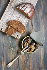 Image showing Snack - sprats and bread.