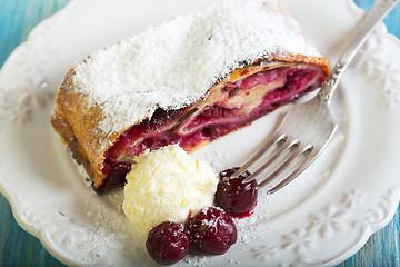 Image showing Plate with cherry strudel closeup.