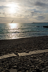 Image showing Sunset on a deserted beach.