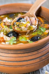 Image showing Thick meat soup in a ceramic pot.