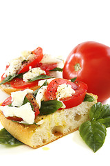 Image showing Sandwich with tomato, cheese and basil.