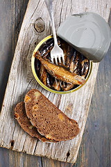 Image showing Sprats in a tin and fork.