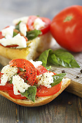 Image showing Ciabatta with tomatoes, cheese and basil.