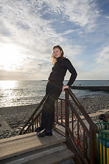 Image showing Beautiful girl in the rays of the setting sun.