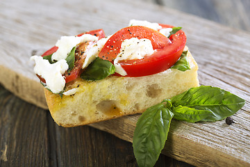 Image showing Tomatoes, mozzarella and basil on ciabatta.
