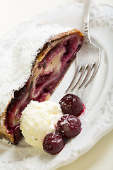 Image showing Cherry strudel and ice cream.