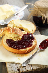 Image showing Bagel with jam and butter.