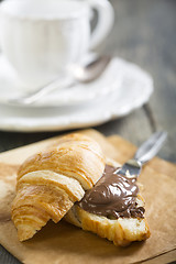 Image showing Croissant with chocolate on a sheet of parchment.