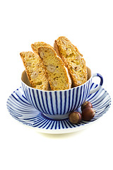 Image showing Biscotti in striped teacup.