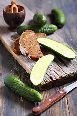 Image showing Black bread and fresh cucumbers.