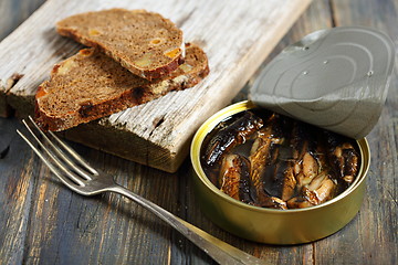 Image showing Sprats and black bread.