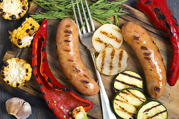 Image showing Sausages and grilled vegetables closeup.