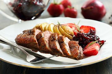 Image showing Duck breast with onion confit and potatoes.