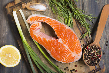 Image showing Salmon, lemon,onion and spices.