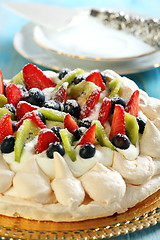 Image showing Meringue with cream and strawberries.