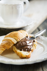 Image showing Croissant with chocolate for breakfast. 