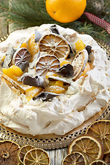 Image showing Pavlova with spicy cream with Christmas decor.