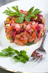 Image showing Traditional Russian beetroot salad, vegetables and a spicy sauce