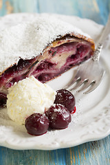 Image showing Plate with cherry strudel.