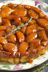 Image showing Tarte Tatin with peaches and thyme.