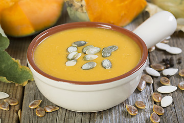 Image showing Pumpkin soup with seeds closeup.