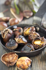 Image showing Frying pan with roasted chestnuts.