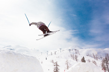 Image showing Free style skier performing a high jump