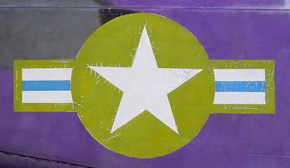 Image showing Tail of Vietnam war Airplane, green and purple