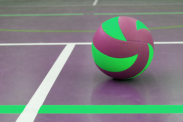 Image showing Green and purple ball on court at break time