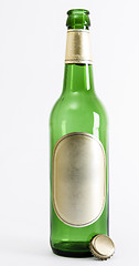 Image showing empty green beer bottle with crown seal