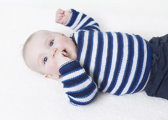 Image showing baby lying on his back