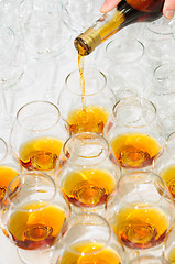 Image showing pouring the brandy or cognac