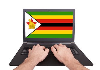 Image showing Hands working on laptop, Zimbabwe