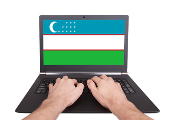Image showing Hands working on laptop, Uzbekistan